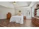 Comfortable main bedroom with vaulted ceiling, wood floors, and natural light from large windows at 1128 Strath Clyde Way, Mcdonough, GA 30253