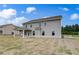 Wide backyard view showing the home's patio, lawn, and exterior at 111 Felicity Pike, Locust Grove, GA 30248
