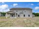 Large backyard with covered patio, perfect for outdoor living and entertaining at 111 Felicity Pike, Locust Grove, GA 30248