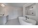 Bathroom featuring soaking tub, tiled shower, and vanity sink at 111 Felicity Pike, Locust Grove, GA 30248