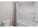 Clean bathroom featuring a shower-tub combo, neutral walls, and white fixtures at 111 Felicity Pike, Locust Grove, GA 30248