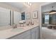 Well-lit bathroom with dual sinks, white countertops, and neutral walls at 111 Felicity Pike, Locust Grove, GA 30248