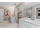 Well-lit bathroom with dual sinks, soaking tub, and a separate glass shower at 111 Felicity Pike, Locust Grove, GA 30248