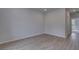 Clean, empty room with hardwood floors and a large window, perfect for customization at 111 Felicity Pike, Locust Grove, GA 30248