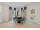 Cozy dining area features a round table, stylish chairs, and an exit to the backyard patio at 111 Felicity Pike, Locust Grove, GA 30248