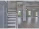 Inviting entryway with hardwood floors, staircase, and ample natural light at 111 Felicity Pike, Locust Grove, GA 30248