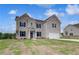 Charming two-story home featuring a well-manicured lawn and a spacious two-car garage at 111 Felicity Pike, Locust Grove, GA 30248