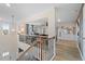 Open foyer with a modern chandelier, leading to the living areas on the upper level at 111 Felicity Pike, Locust Grove, GA 30248