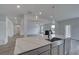 Modern kitchen with stainless steel sink, stone counters, and an open floor plan at 111 Felicity Pike, Locust Grove, GA 30248