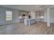 Well-equipped kitchen with a center island, modern appliances, and ample cabinet space at 111 Felicity Pike, Locust Grove, GA 30248