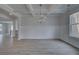 Open-concept living room with coffered ceilings and hardwood floors at 111 Felicity Pike, Locust Grove, GA 30248