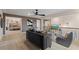 Upstairs living area with stylish furniture, neutral color scheme, TV, and an open view at 111 Felicity Pike, Locust Grove, GA 30248