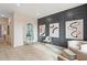 Sophisticated living room featuring unique wall decor, modern lighting, and comfortable seating at 111 Felicity Pike, Locust Grove, GA 30248