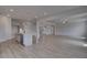 Spacious open-concept living area with modern kitchen and hardwood flooring throughout at 111 Felicity Pike, Locust Grove, GA 30248