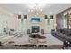 Spacious living room showcasing a fireplace, modern furniture, neutral tones, and ample seating at 111 Felicity Pike, Locust Grove, GA 30248