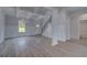 Open-concept living room with coffered ceilings and hardwood floors at 111 Felicity Pike, Locust Grove, GA 30248