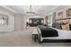 Expansive main bedroom boasts a lounge area, tray ceiling, a king bed, and access to the ensuite at 111 Felicity Pike, Locust Grove, GA 30248