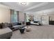 Spacious main bedroom boasts a lounge area, tray ceiling, a large window, and ensuite bathroom access at 111 Felicity Pike, Locust Grove, GA 30248