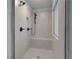 Walk-in shower featuring tiled walls, a built-in bench, and sleek fixtures at 111 Felicity Pike, Locust Grove, GA 30248