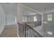 View of the foyer, staircase, banister, and entry to the home at 111 Felicity Pike, Locust Grove, GA 30248