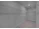 Walk-in closet with white wire shelving at 111 Felicity Pike, Locust Grove, GA 30248