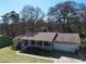 Charming single-story home with a front porch, attached garage, and well-maintained lawn at 1312 Jordan Rd, Powder Springs, GA 30127