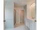 Bright bathroom with double vanity, white cabinets, and glass enclosed shower at 193 Haverling Pass, Hampton, GA 30228