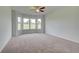 Bedroom featuring large windows and plush carpeting at 193 Haverling Pass, Hampton, GA 30228