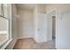 Walk-in closet with carpet flooring and window with natural light, offering ample storage space with metal racks at 193 Haverling Pass, Hampton, GA 30228