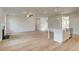 Spacious living room area featuring a fireplace, wood floors and open to kitchen at 193 Haverling Pass, Hampton, GA 30228