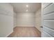 Walk-in closet with ample shelving for storage and organization at 193 Haverling Pass, Hampton, GA 30228