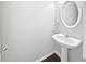 Powder room with modern pedestal sink and neutral wall color at 2555 Flat Shoals Rd # 3103, Atlanta, GA 30349