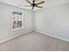 Neutral bedroom with soft carpet, a ceiling fan, and ample natural light from a large window at 2555 Flat Shoals Rd # 3103, Atlanta, GA 30349