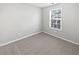 Cozy bedroom with neutral walls and carpet and a window at 2555 Flat Shoals Rd # 3103, Atlanta, GA 30349