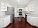 Modern kitchen with stainless steel appliances, white cabinets, and hardwood floors at 2555 Flat Shoals Rd # 3103, Atlanta, GA 30349