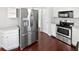 Well-equipped kitchen with stainless steel refrigerator and stove provides everything for cooking needs at 2555 Flat Shoals Rd # 3103, Atlanta, GA 30349