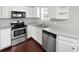 Well-lit kitchen featuring stainless steel appliances and wood flooring at 2555 Flat Shoals Rd # 3103, Atlanta, GA 30349