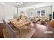 Bright open-concept living and dining area features hardwood floors and abundant natural light at 2555 Flat Shoals Rd # 3103, Atlanta, GA 30349
