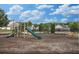 Enjoy the community playground with a slide and play equipment, all surrounded by a mulch base at 2555 Flat Shoals Rd # 3103, Atlanta, GA 30349
