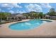 Inviting community pool and clubhouse with a surrounding fence and beautiful blue sky views at 2555 Flat Shoals Rd # 3103, Atlanta, GA 30349