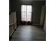 Bedroom with wood laminate floors, neutral paint, and a closet at 3030 Parc Lorraine, Lithonia, GA 30038