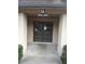The entrance to the house has double doors and a sign above the door with the address at 3030 Parc Lorraine, Lithonia, GA 30038