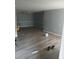 A spacious living room with sleek wood floors and a neutral paint palette at 3030 Parc Lorraine, Lithonia, GA 30038