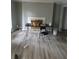 Living room features fireplace, wood laminate floors, and neutral paint at 3030 Parc Lorraine, Lithonia, GA 30038
