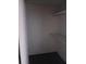 A dark room with black carpet and white shelves at 3030 Parc Lorraine, Lithonia, GA 30038
