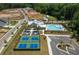 Aerial view of community amenities, including pool, tennis courts, and parking at 5120 Token Chase, Cumming, GA 30040