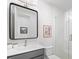Modern bathroom with a glass-enclosed shower, large mirror, and vanity sink at 5120 Token Chase, Cumming, GA 30040