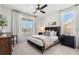 Serene bedroom featuring large windows with sheer curtains, providing soft natural light at 5120 Token Chase, Cumming, GA 30040