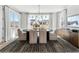 Elegant dining room with large windows, modern chandelier, and stylish rug at 5120 Token Chase, Cumming, GA 30040