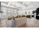 Open-concept living area with high ceilings, large windows, and a seamless flow to the kitchen at 5120 Token Chase, Cumming, GA 30040
